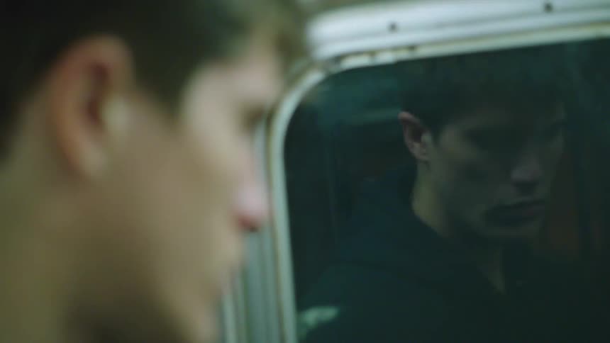 A man is riding the subway