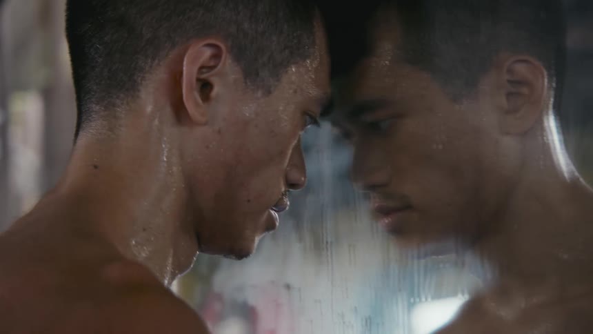 A man is looking at himself in a mirror