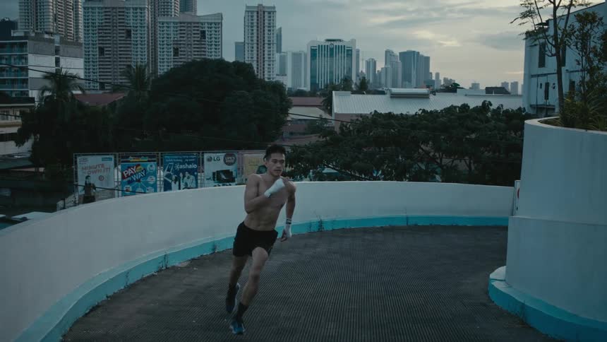 A man is running around the ramp by the building