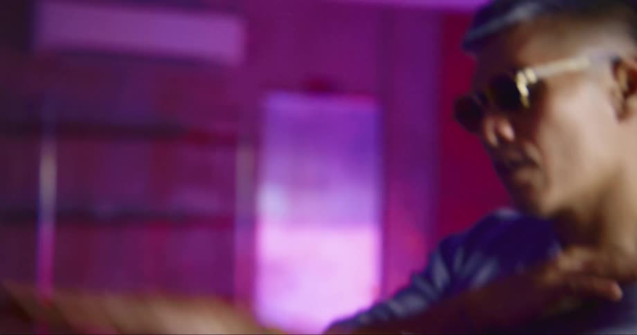 Hip hop dancer rehearsing in a studio filled with neon lights