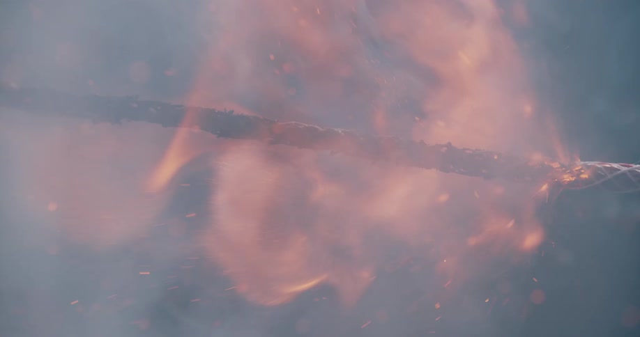 A rope is burning outdoors during the day