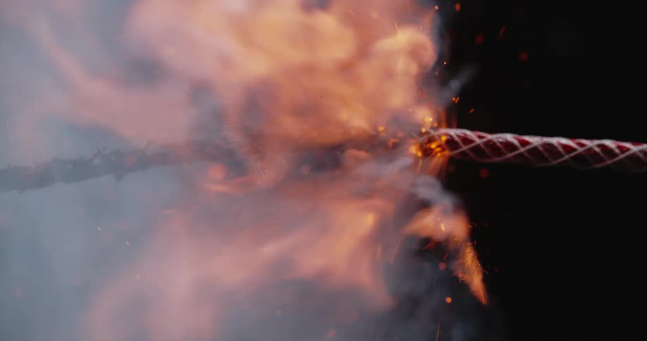 A rope is burning at night