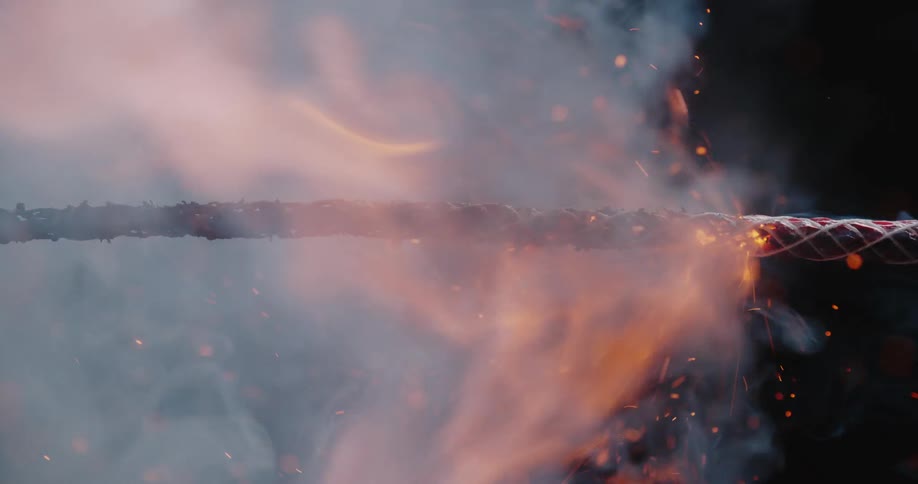 A view of a fuse to a firework burning