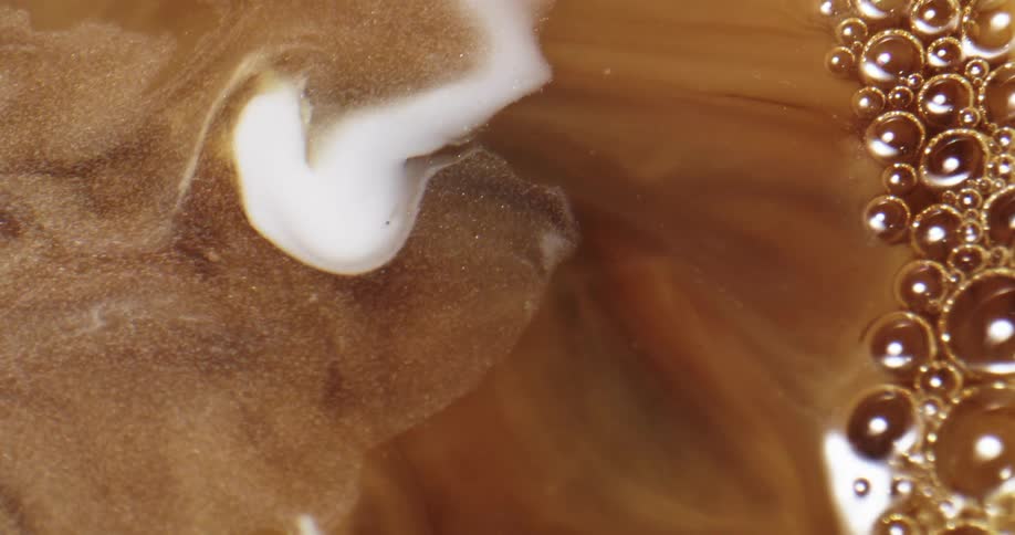 Milk is mixed in the coffee