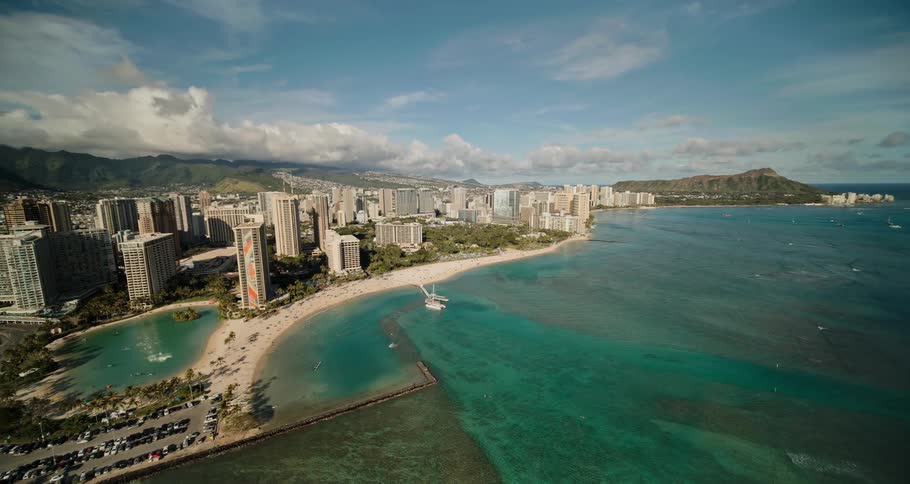 An aerial view of high rise hotels on the shore
