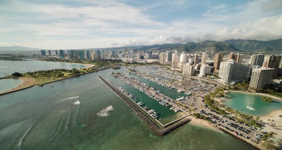 A marina on the coast of a metropolis during the day