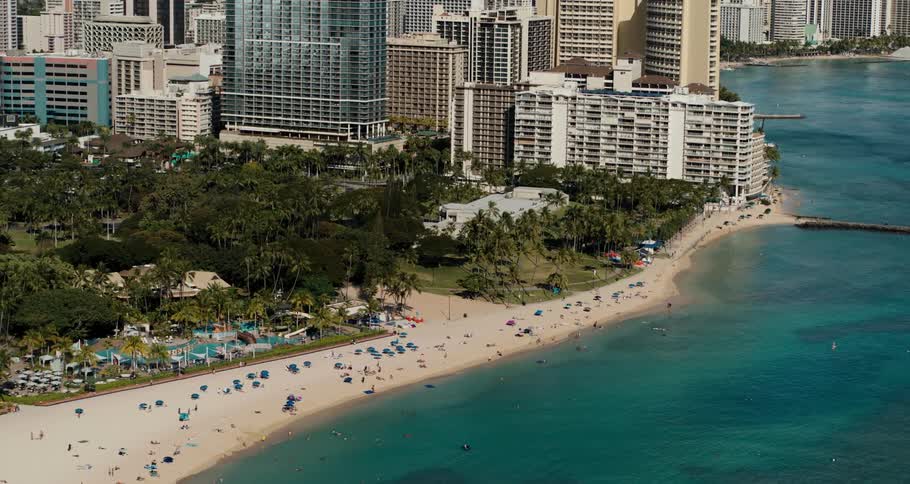 People are visiting the beach by the city