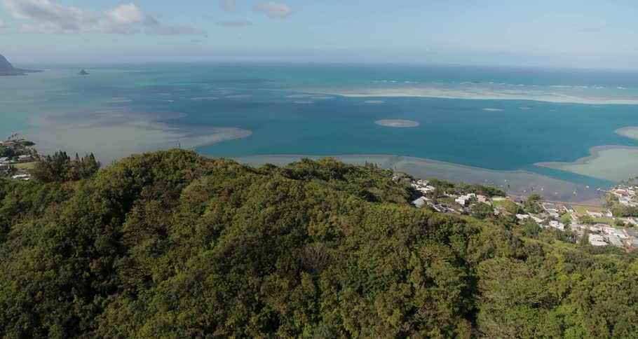 View of the sea and coastline from over the top of a mountain
