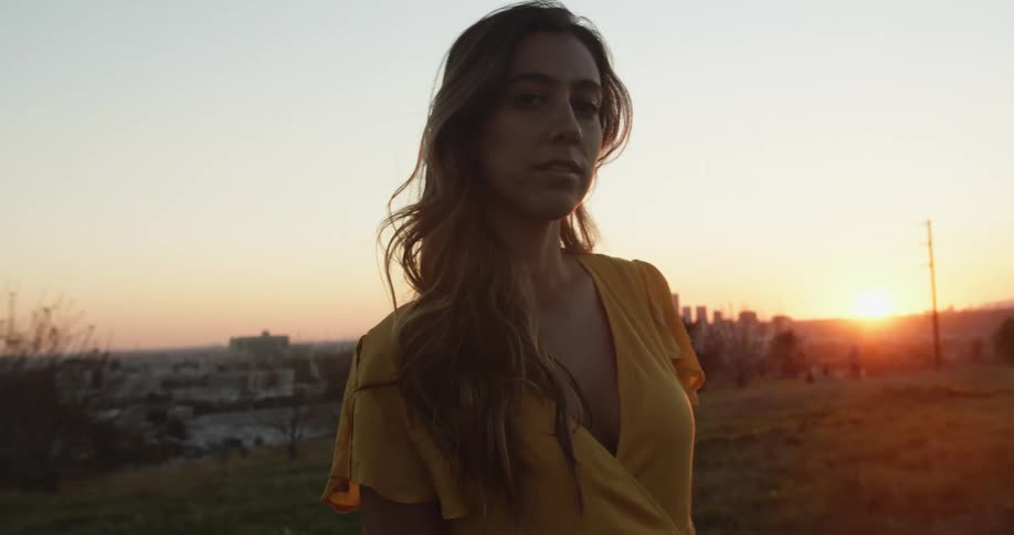 A portrait of a woman standing outdoors