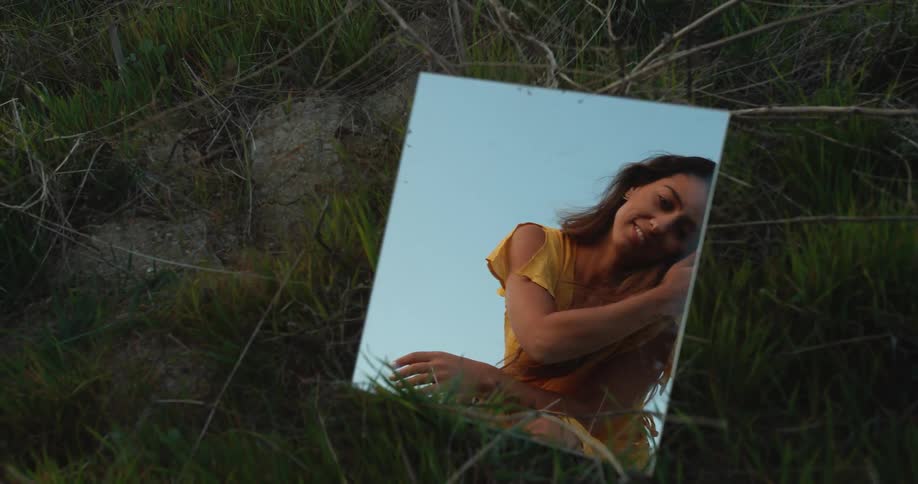 A portrait of a woman in a mirror