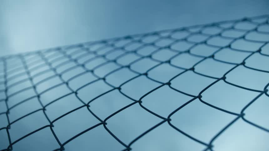 Chain link fence with a blue sky in the background