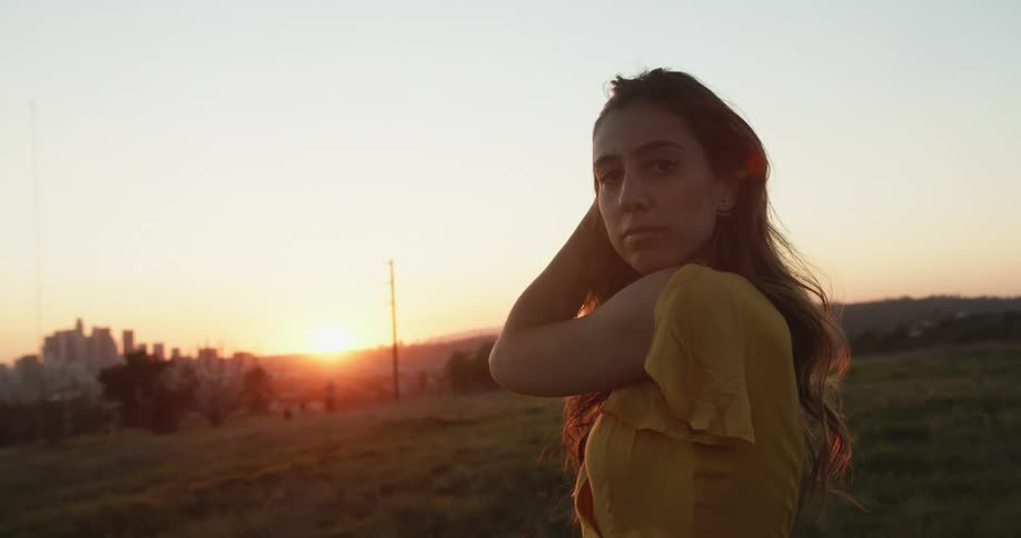 A portrait of a woman at sunset