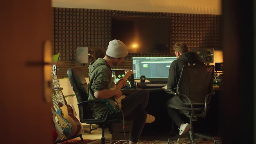 Two men recording music in a studio