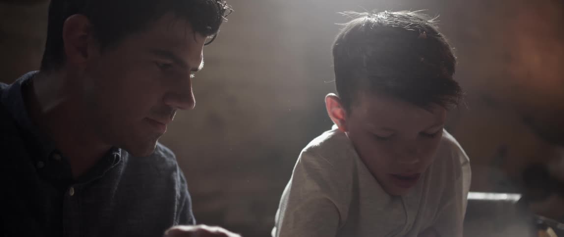 A man is talking to a child