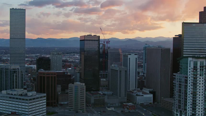 An aerial view of a city at sunset