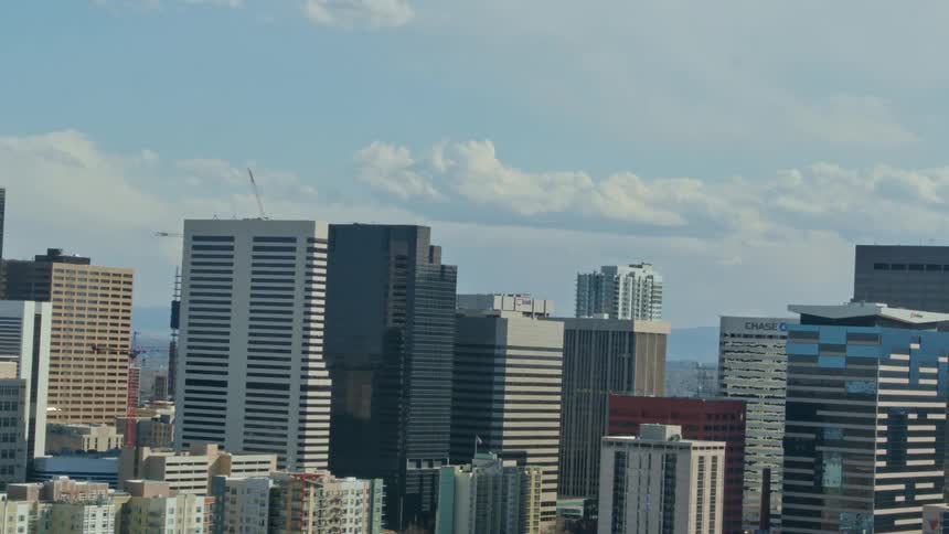 Skyscrapers of varying heights and construction materials fill a city skyline