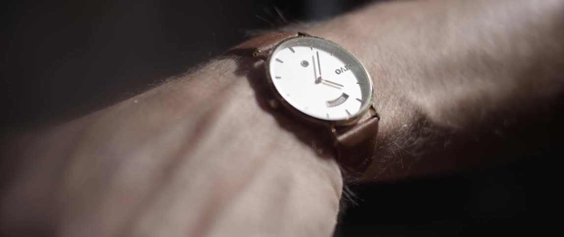 Close-up of an analog watch on a man's wrist