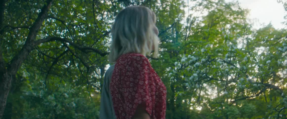A man and woman walking together outdoors