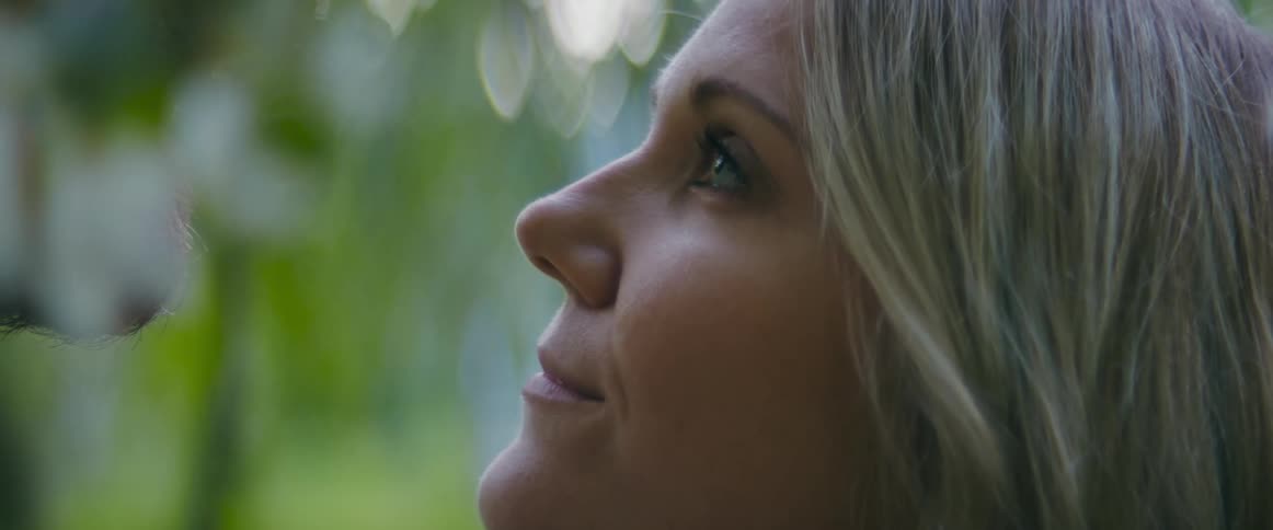 A woman gazes up lovingly at her bearded mate