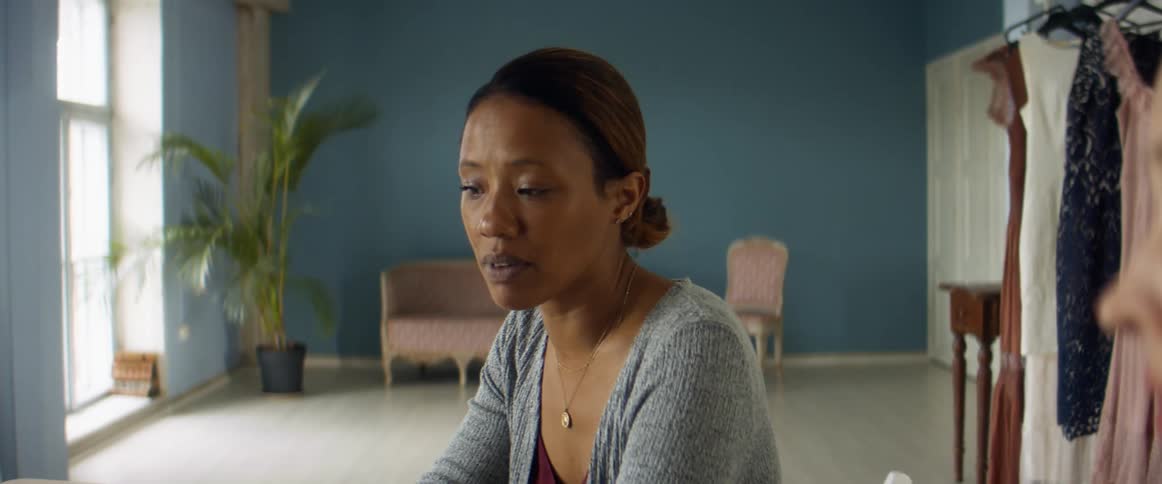 Two women talking to each other in a business