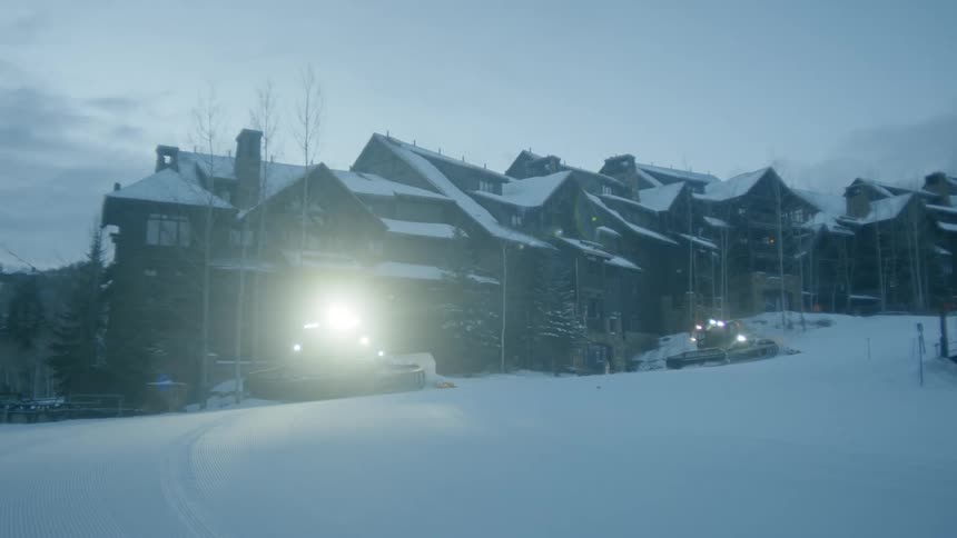 Snow plows clearing streets in a neighborhood