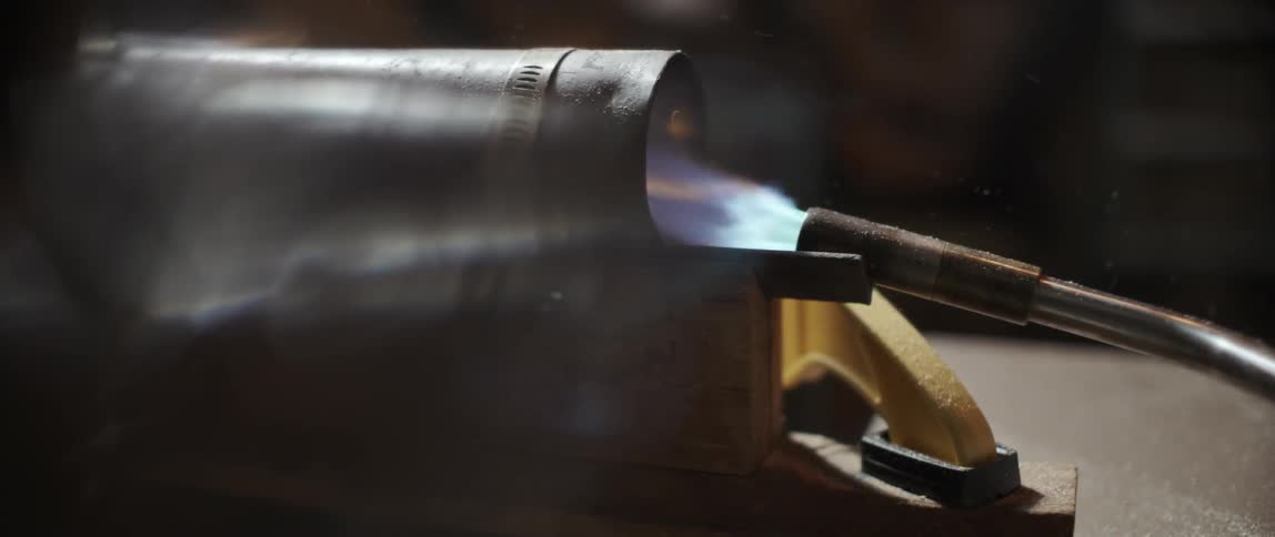 A blow torch fires into a tube
