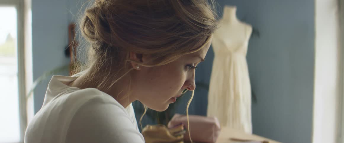 A close up of a woman thinking in a room