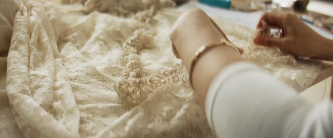 A woman working on a piece of clothing