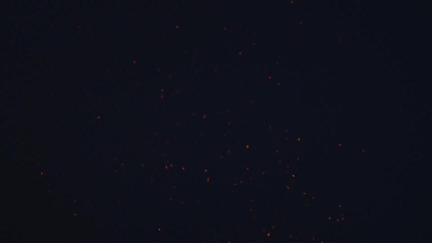 Ember from a fire is in the sky
