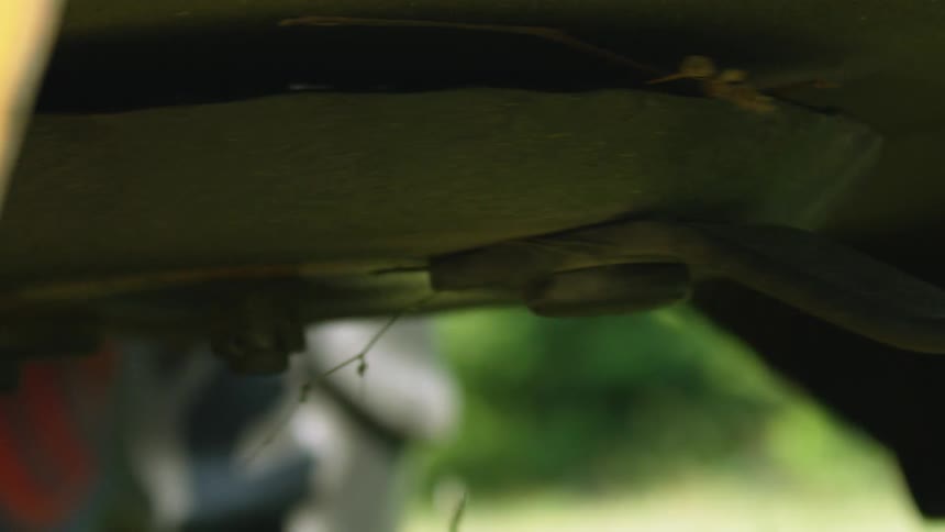 Close up of lawn mower blade rotating in slow motion