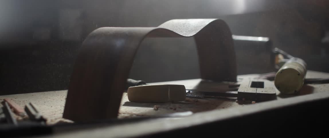What appear to be woodworking tools lay on a table