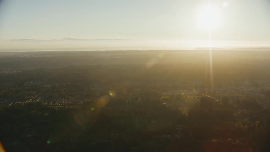 Aerial view of a small town in the plains at sunset