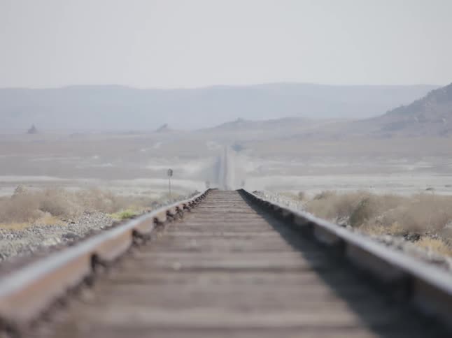 A view from train tracks in the middle of the desert