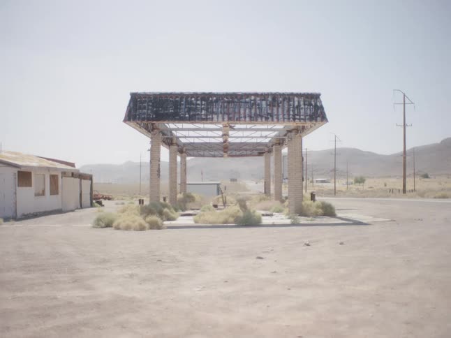 Abandoned and ruined gas station in the desert at daytime