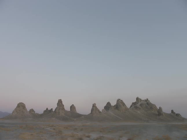 Sand dunes form narrow peaks in a desert