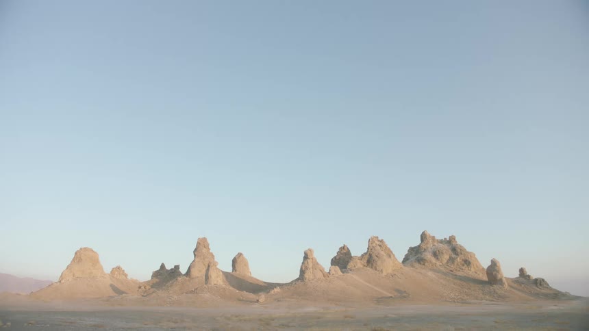 Sand dunes form narrow peaks in a desert