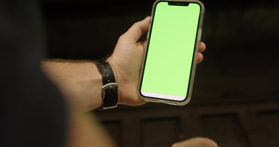 A close up of a person holding a frozen phone