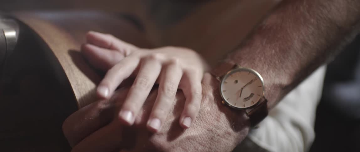 Close up of two hands and a watch