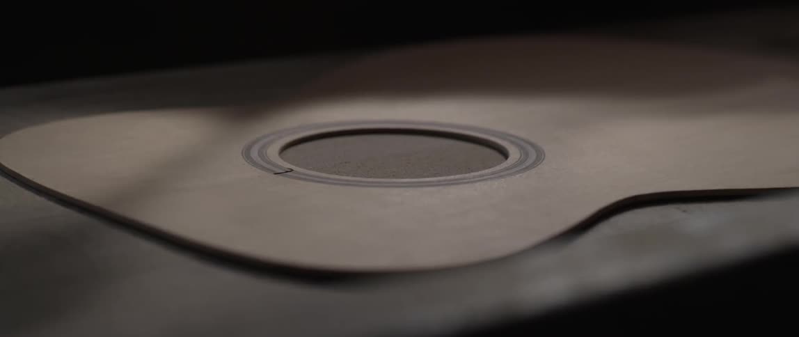 Close up of a guitar being built