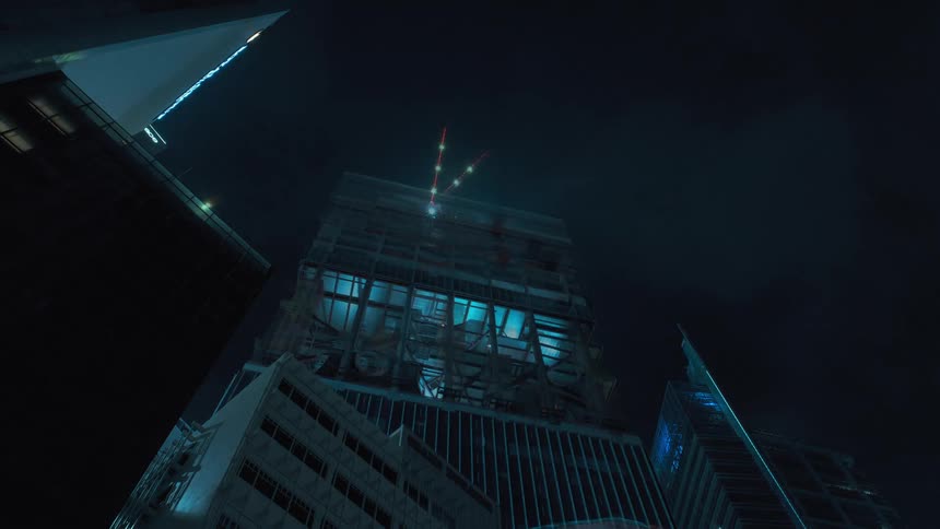 A city skyline with buildings and construction cranes with the sky in the background