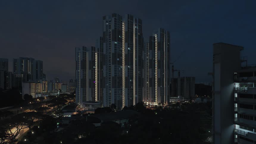 A city skyline with buildings with the sky and clouds in the background
