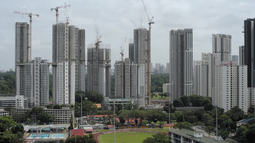 Tall buildings and condos construction with cranes in the city