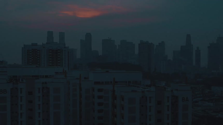 Rising up from street level to watch the sunrise over a city skyline