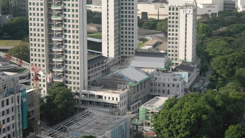 Shadows changes as building is constructed near dense trees
