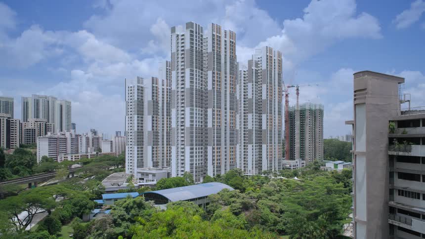 Constructed buildingrises in downtown next to other skyscrapers