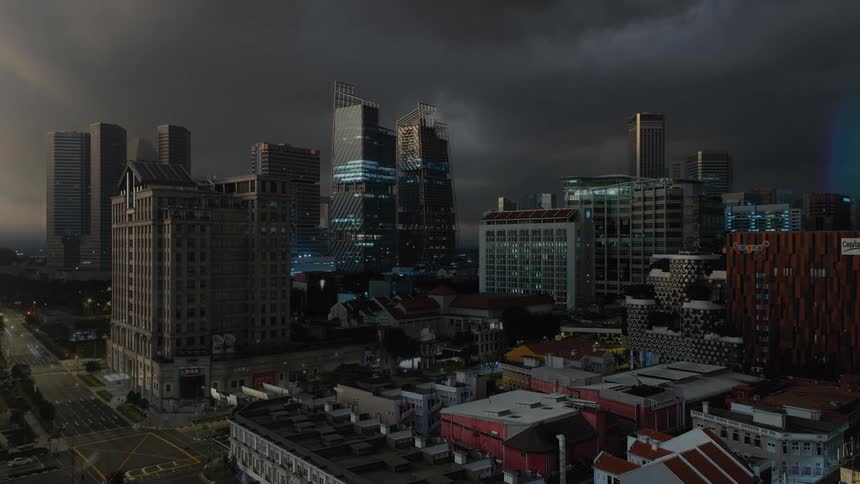 A time lapse reveals multiple tall buildings being constructed in a downtown area
