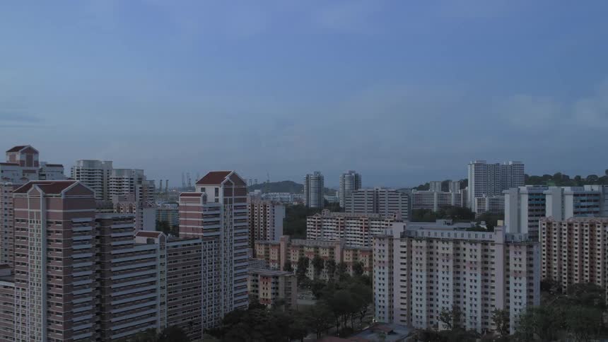 High speed rising timelapse of city changing from day to night