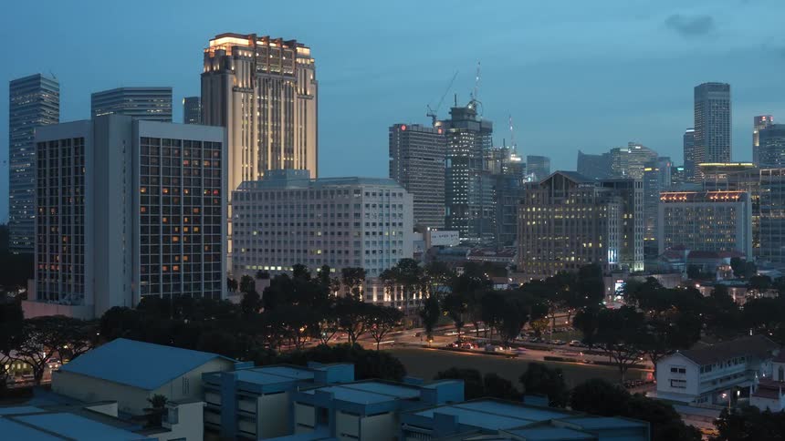 A time lapse reveals skyscrapers being built within a metropolitan area