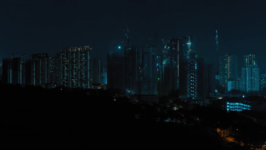 Lights flash over high rise office buildings in a city