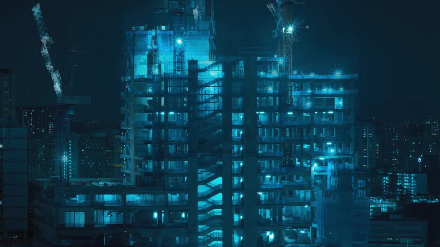 Time lapse of the construction of a building in the citys downtown at night